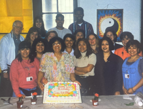 Jim Brett stands with a group of team members celebrating Gads Hill's centennial in 1998.